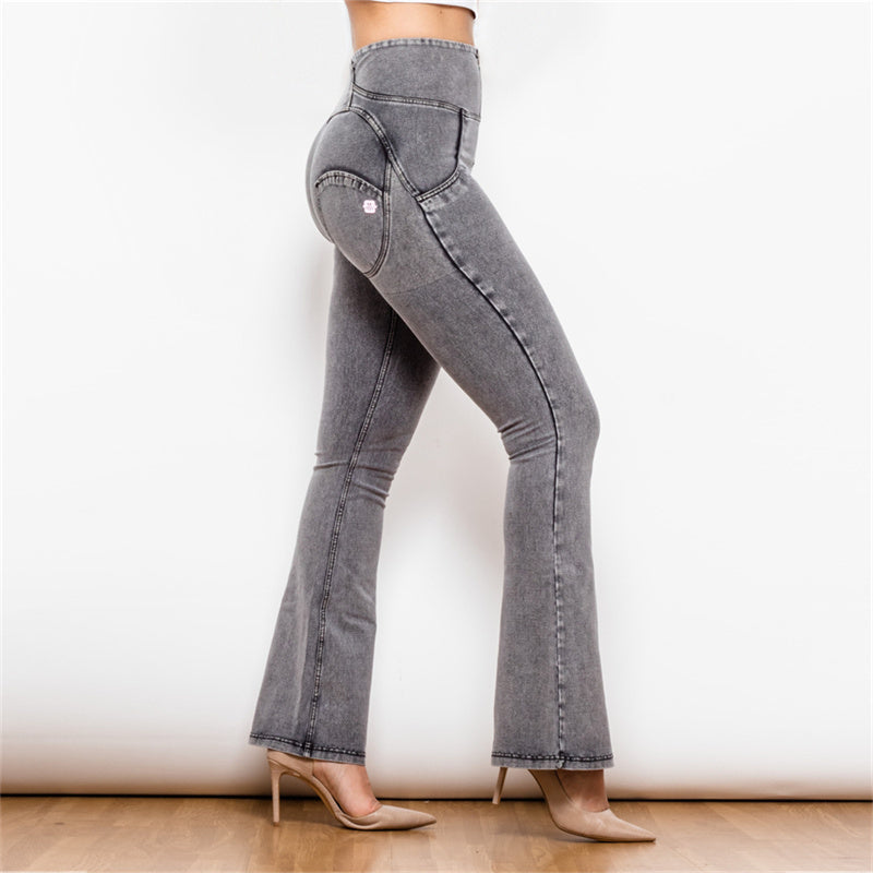 a woman wearing grey jeans