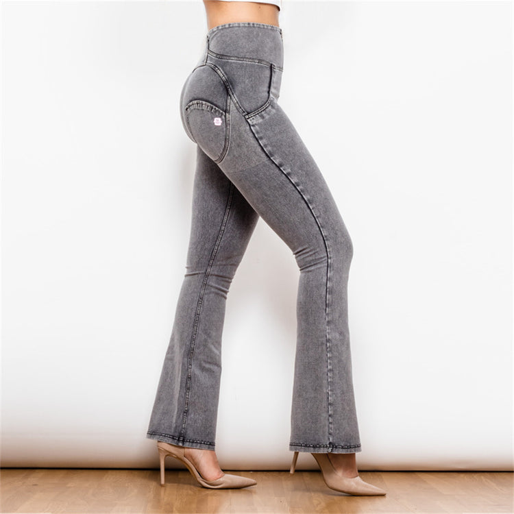 a woman wearing grey jeans