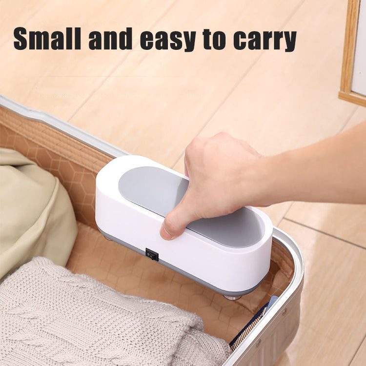 a hand holding a device