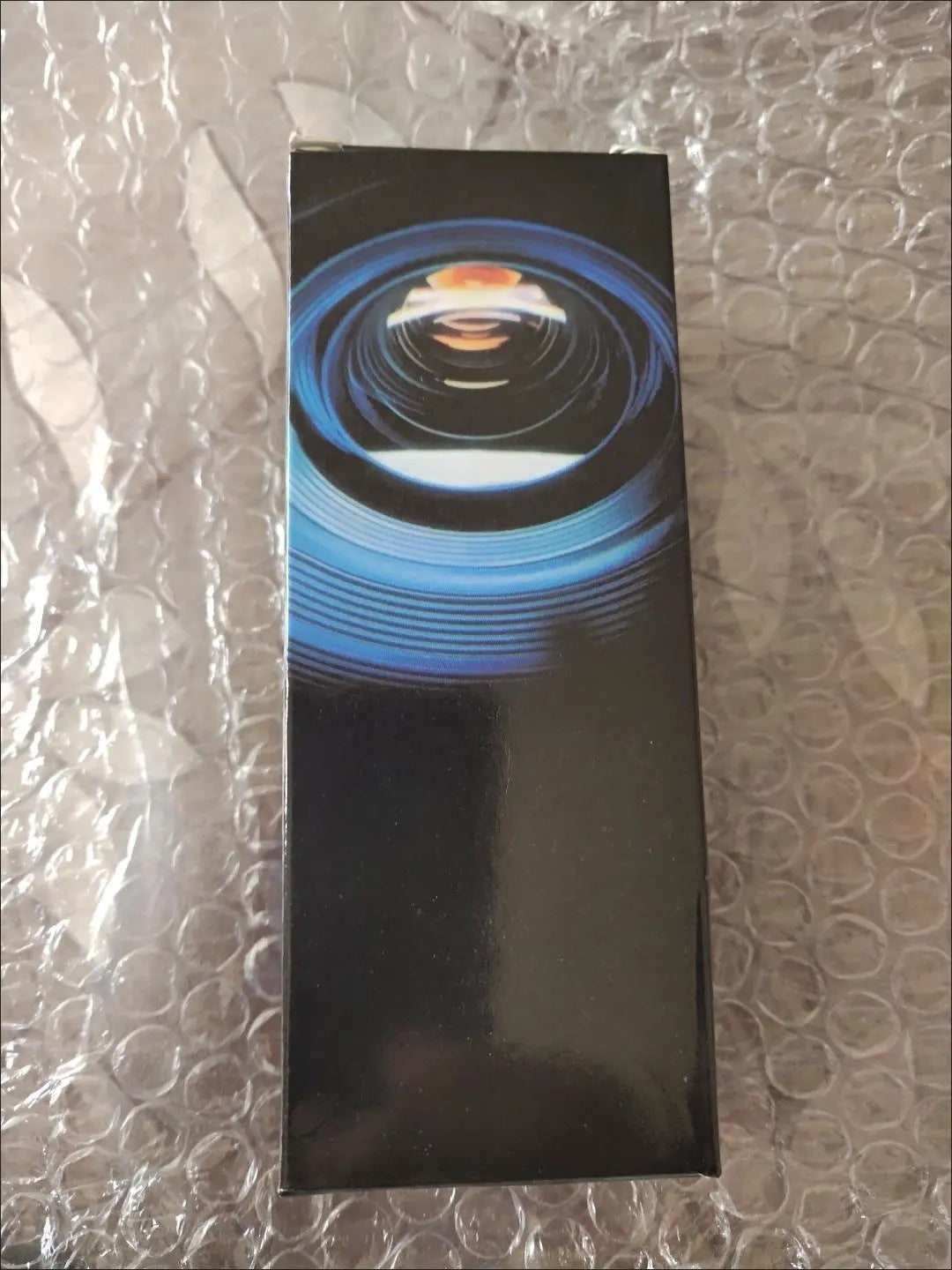 a black box with a blue circle design on it