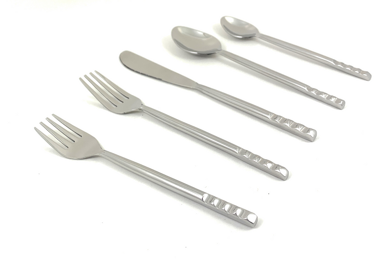 a group of silverware on a white background