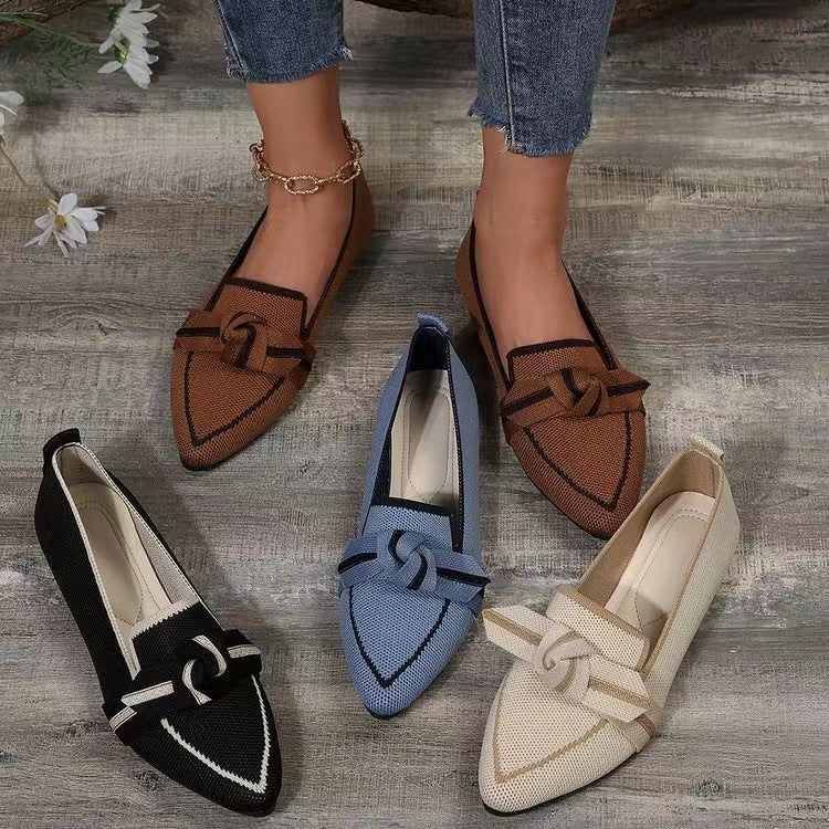 a group of shoes on a wood floor