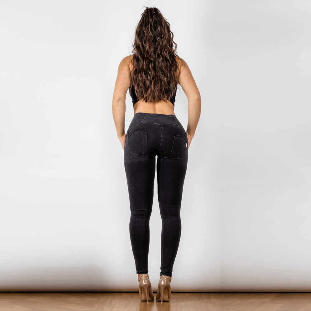 a woman in black jeans and heels