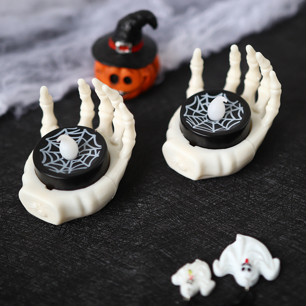 a pair of candles in the shape of hands