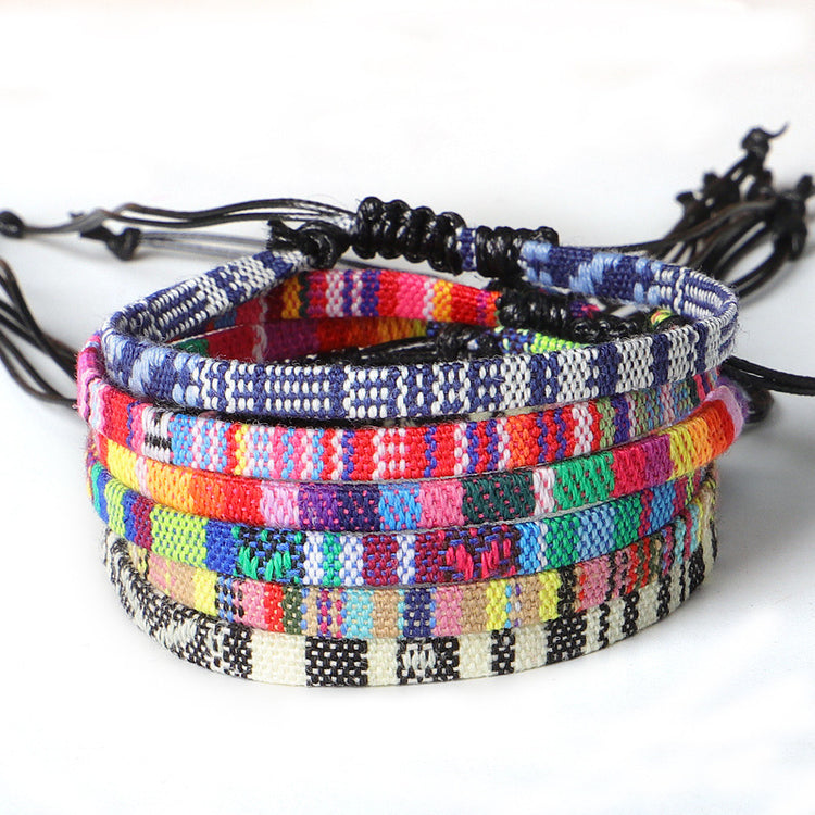 a stack of colorful bracelets