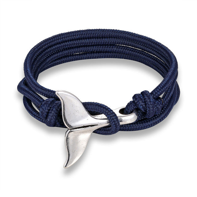 a blue rope bracelet with a silver whale tail