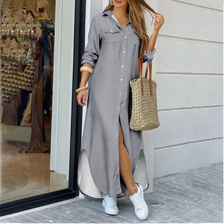 a woman wearing a long dress and white sneakers