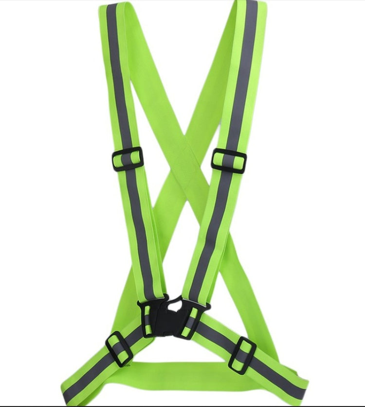 a green safety vest with grey straps