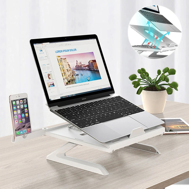 a laptop and cell phone on a stand