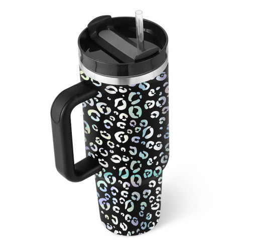 a black and white leopard print coffee mug