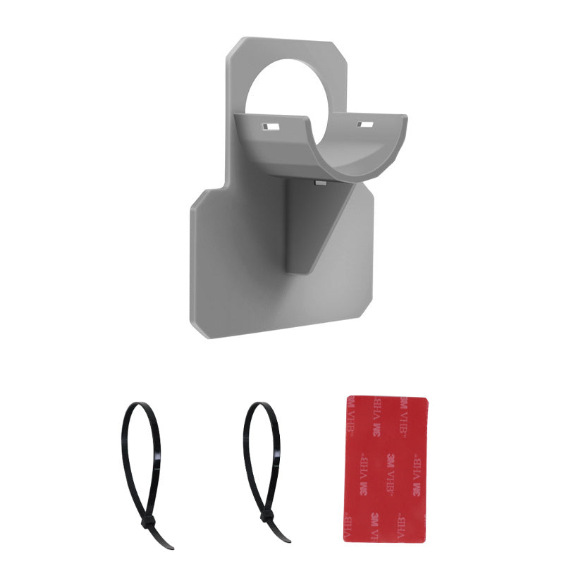a grey object with a red label and a red tag