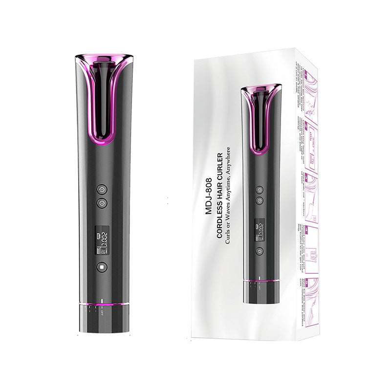a black and pink hair curler
