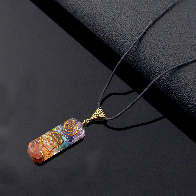 a necklace with a colorful stone pendant