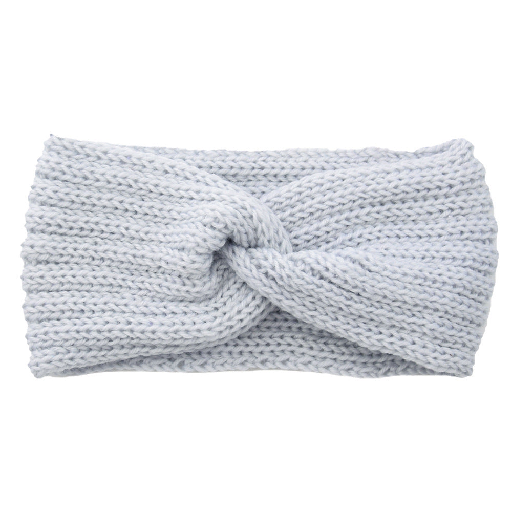 a white knit headband with a knot