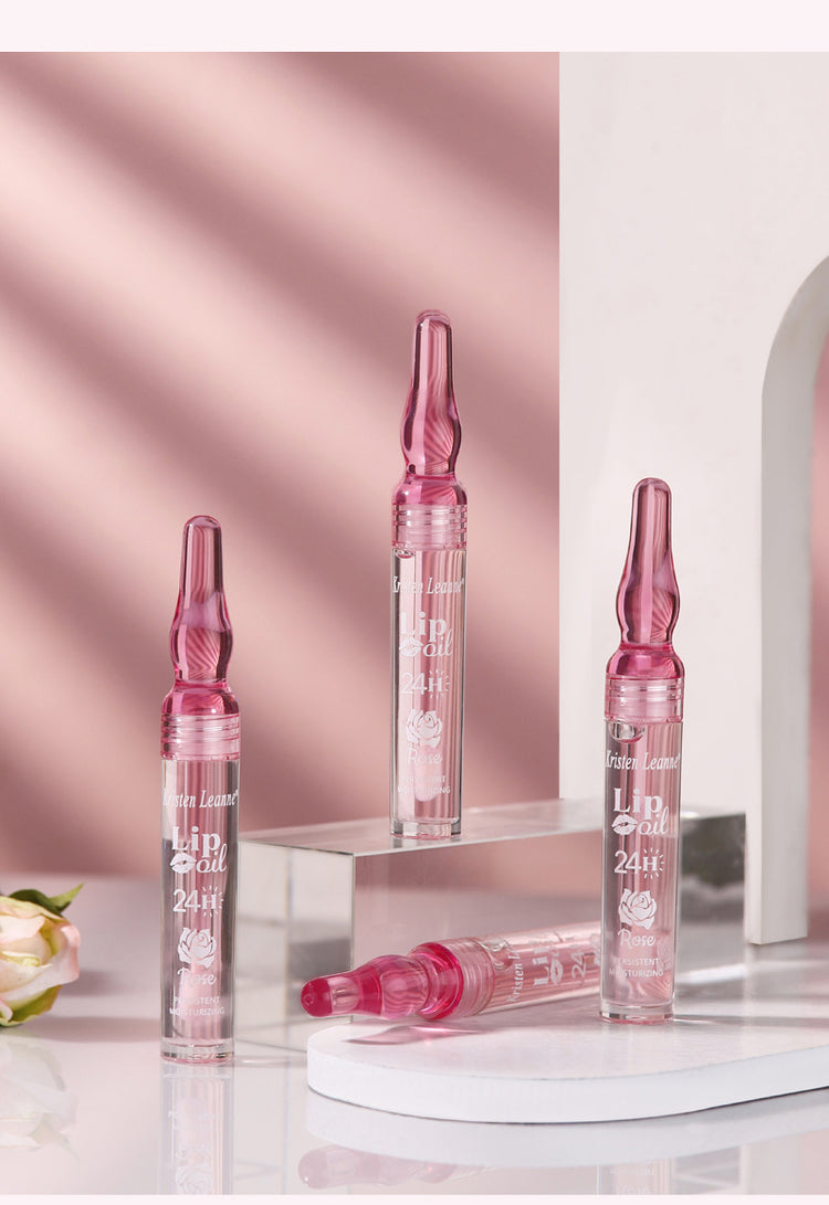 a group of pink ampoules on a shelf
