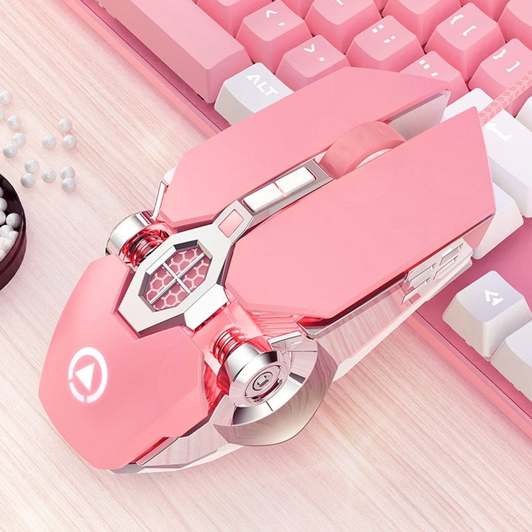 a pink computer mouse on a keyboard