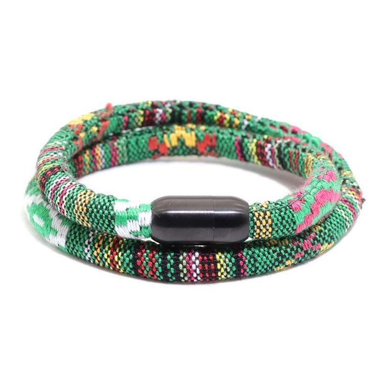 a green and red bracelet with a black oval