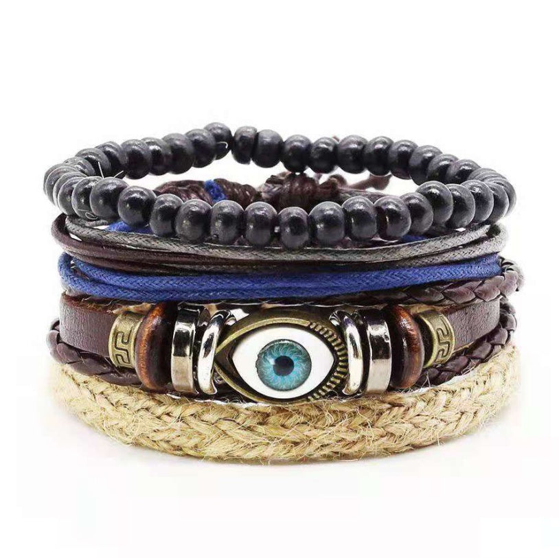 a stack of bracelets with a blue eye