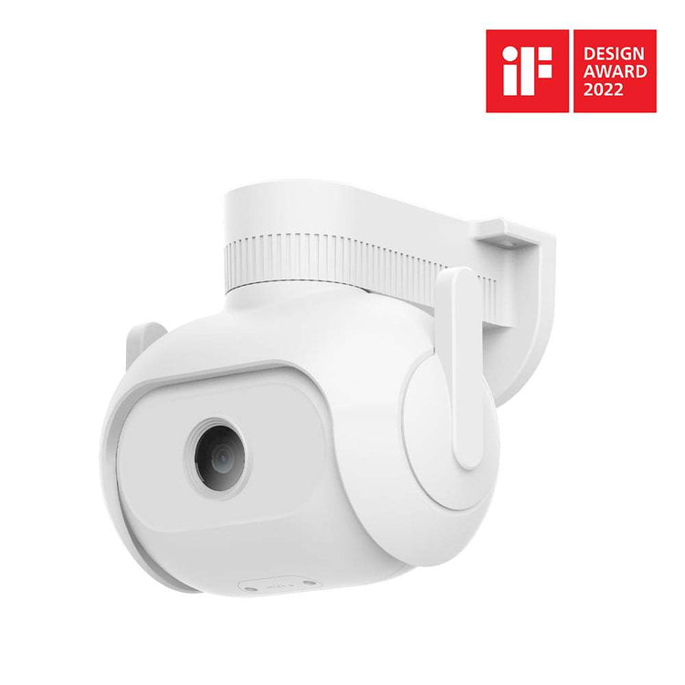 a white camera with a black circle