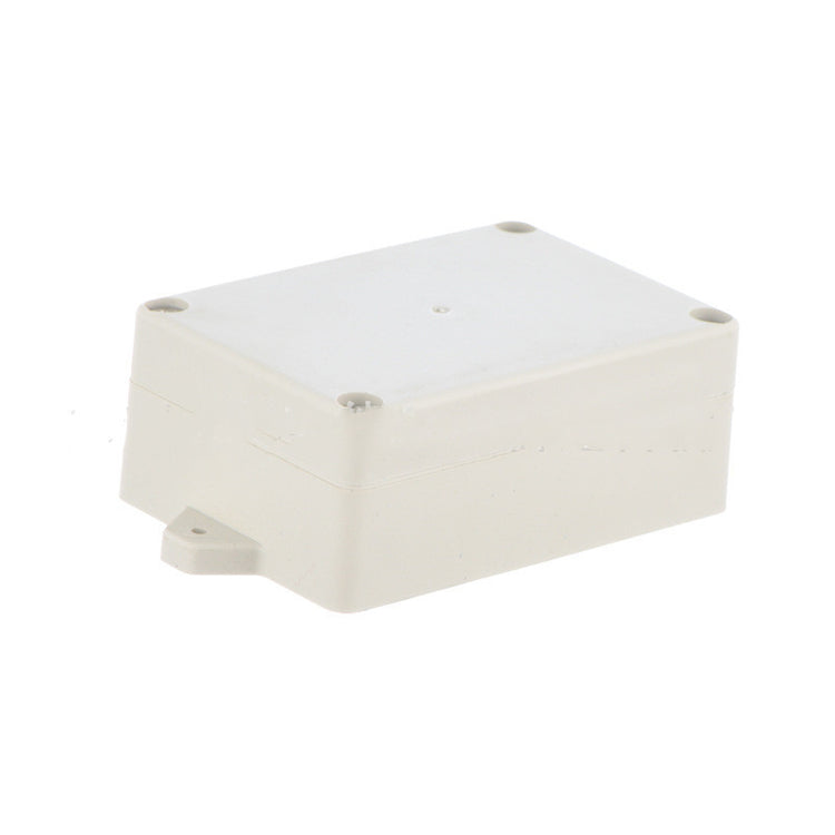a white plastic box with screws