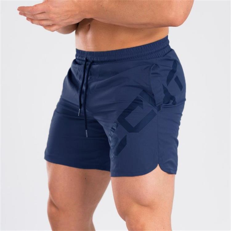 a man wearing blue shorts