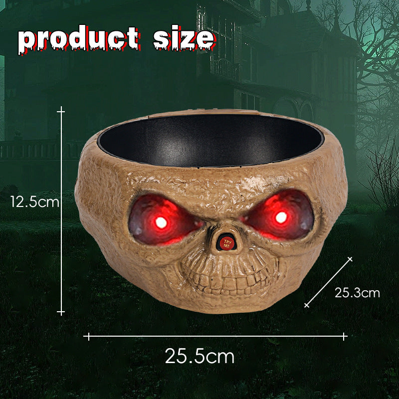 a skull shaped bowl with red eyes