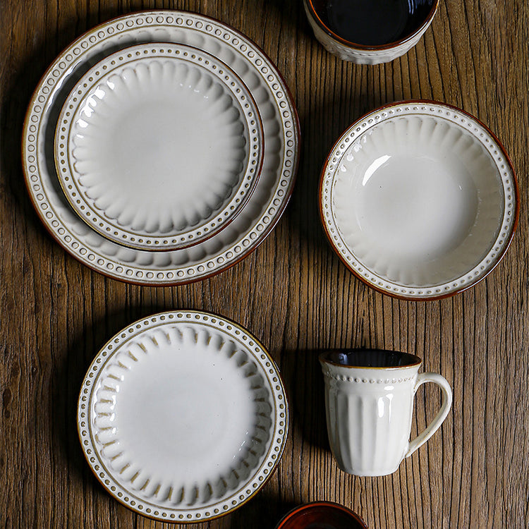a group of plates and cups on a table
