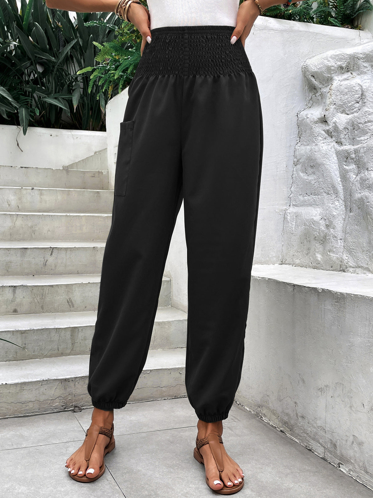 a woman wearing black pants