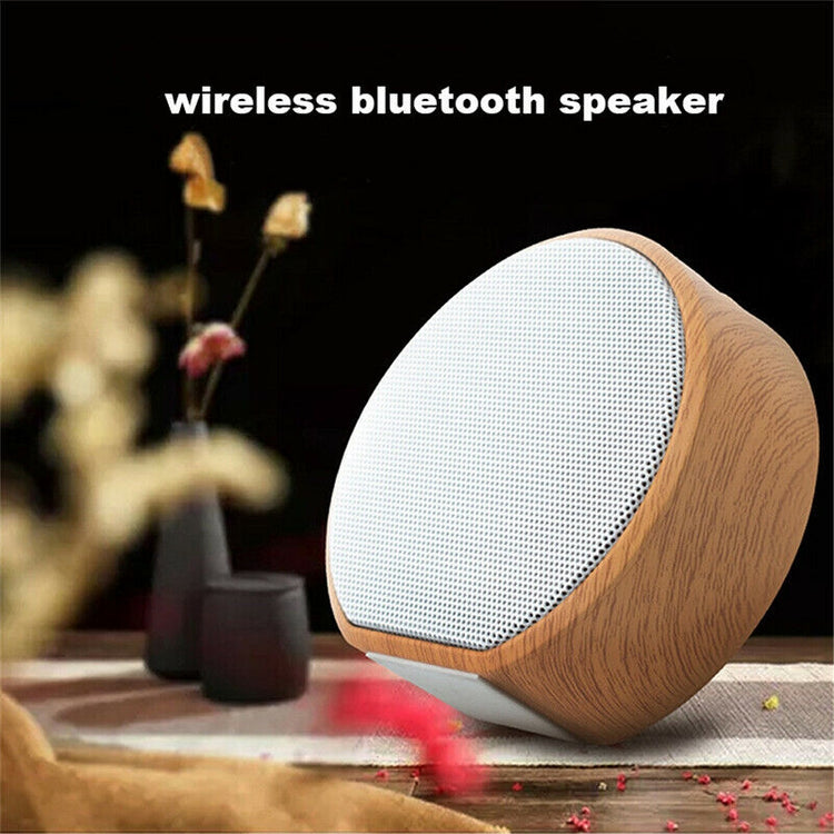 a wireless bluetooth speaker on a table