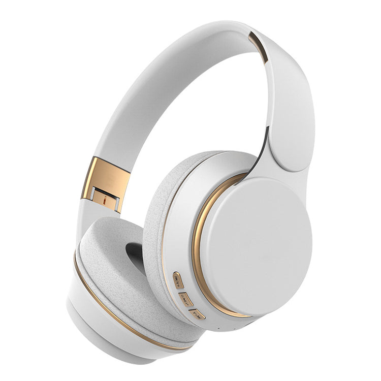 a white headphones with gold accents