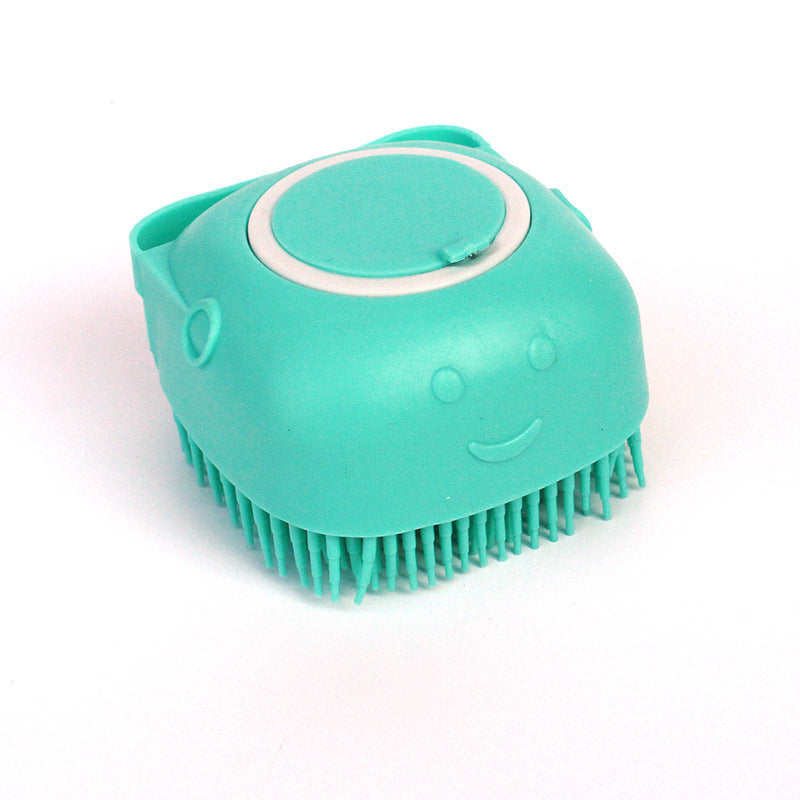 a blue plastic brush with a face on it