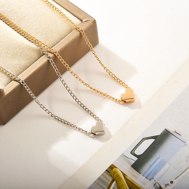 a gold and silver necklaces in a box