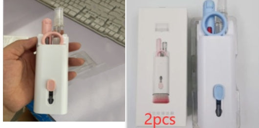 a hand holding a white bottle
