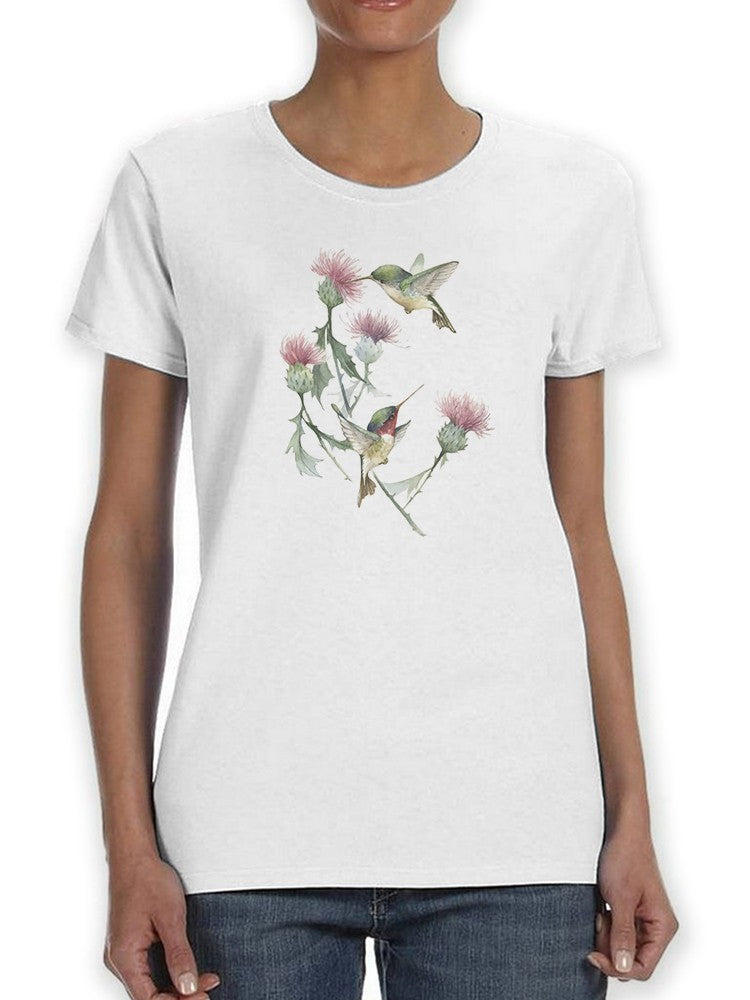a woman wearing a white shirt with birds on it