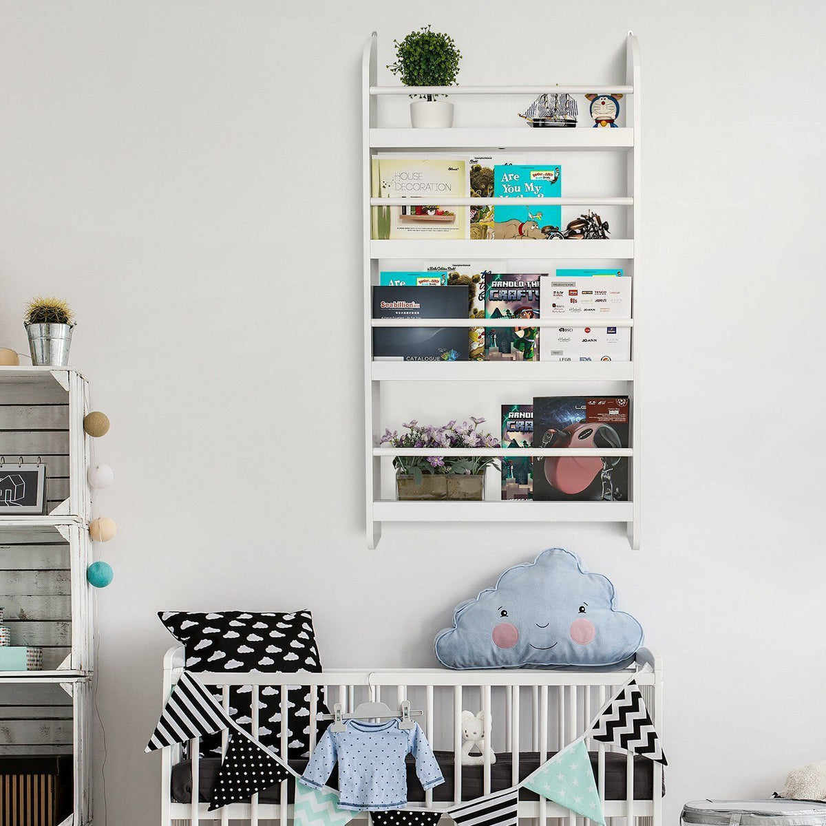 a baby room with a crib and bookshelf