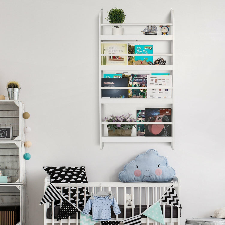 a baby room with a crib and bookshelf