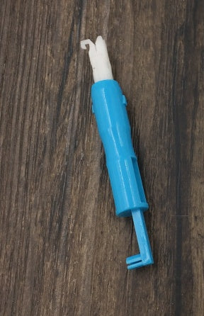 a blue and white plastic tool