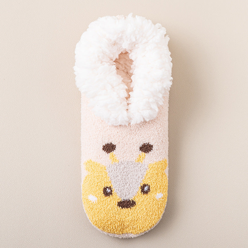 a white and pink fuzzy slipper with a cartoon animal design