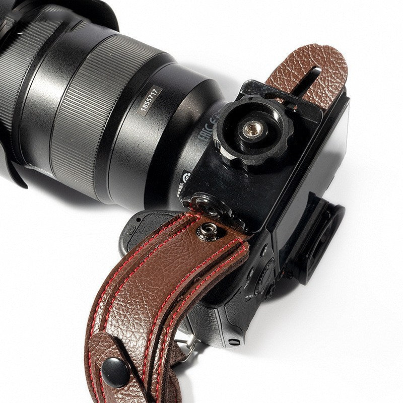 a camera with a leather strap