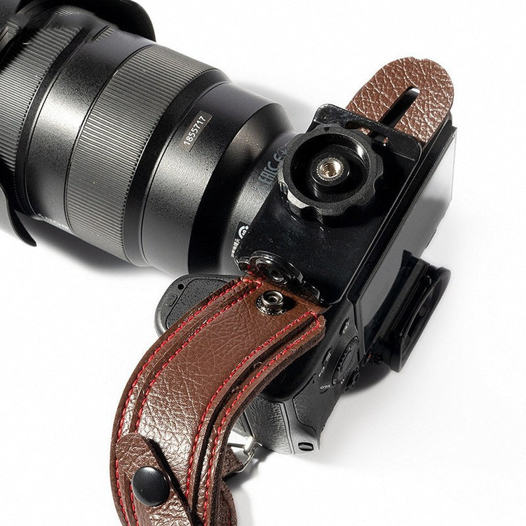 a camera with a leather strap