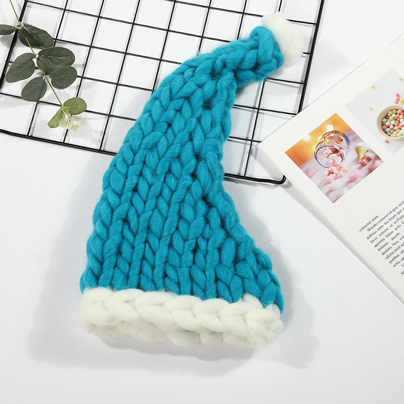 a blue and white knit hat on a grid