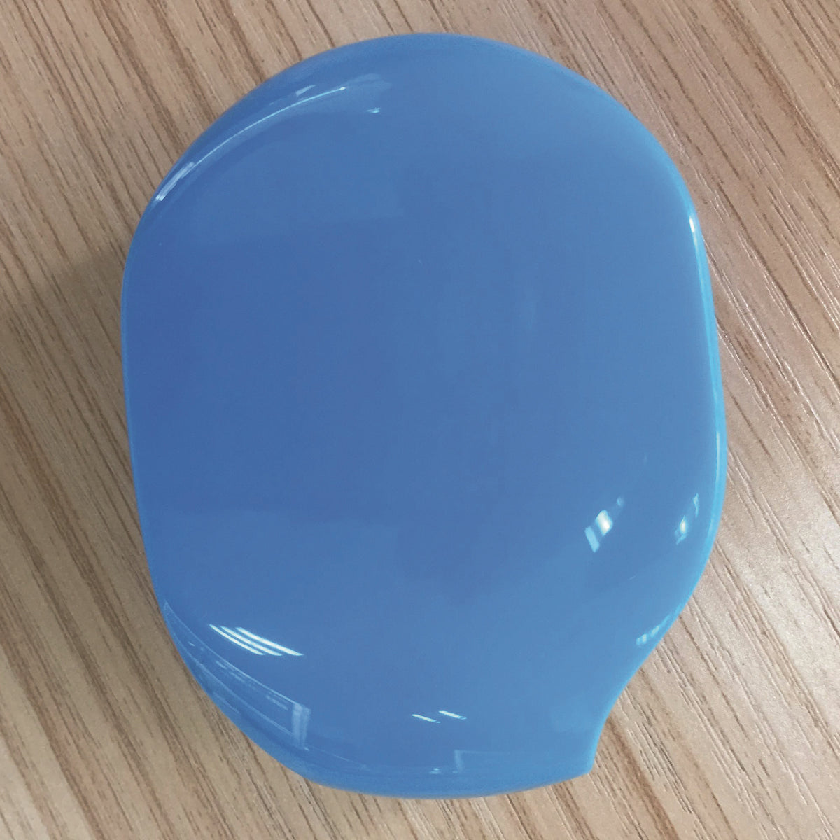 a blue object on a wood surface