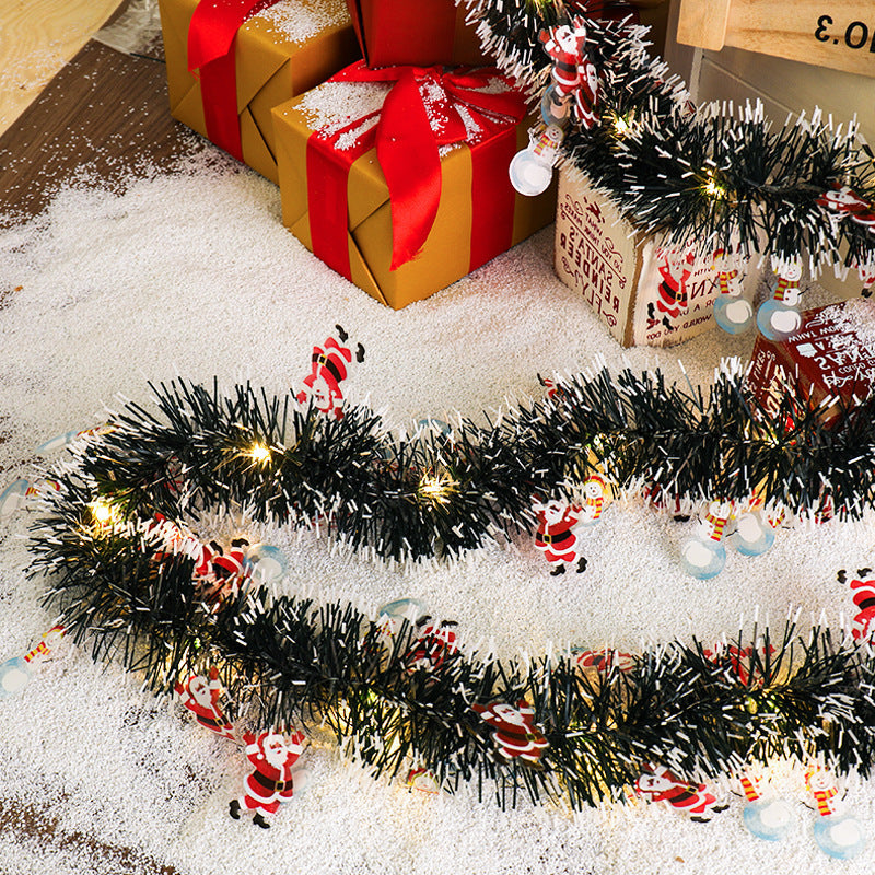 a garland and presents on the floor