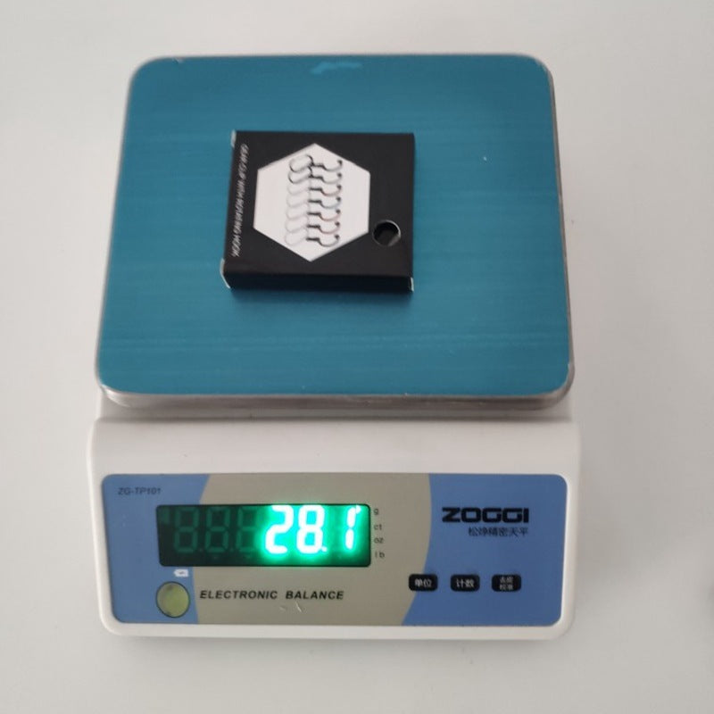 a blue scale with a black piece of paper on top