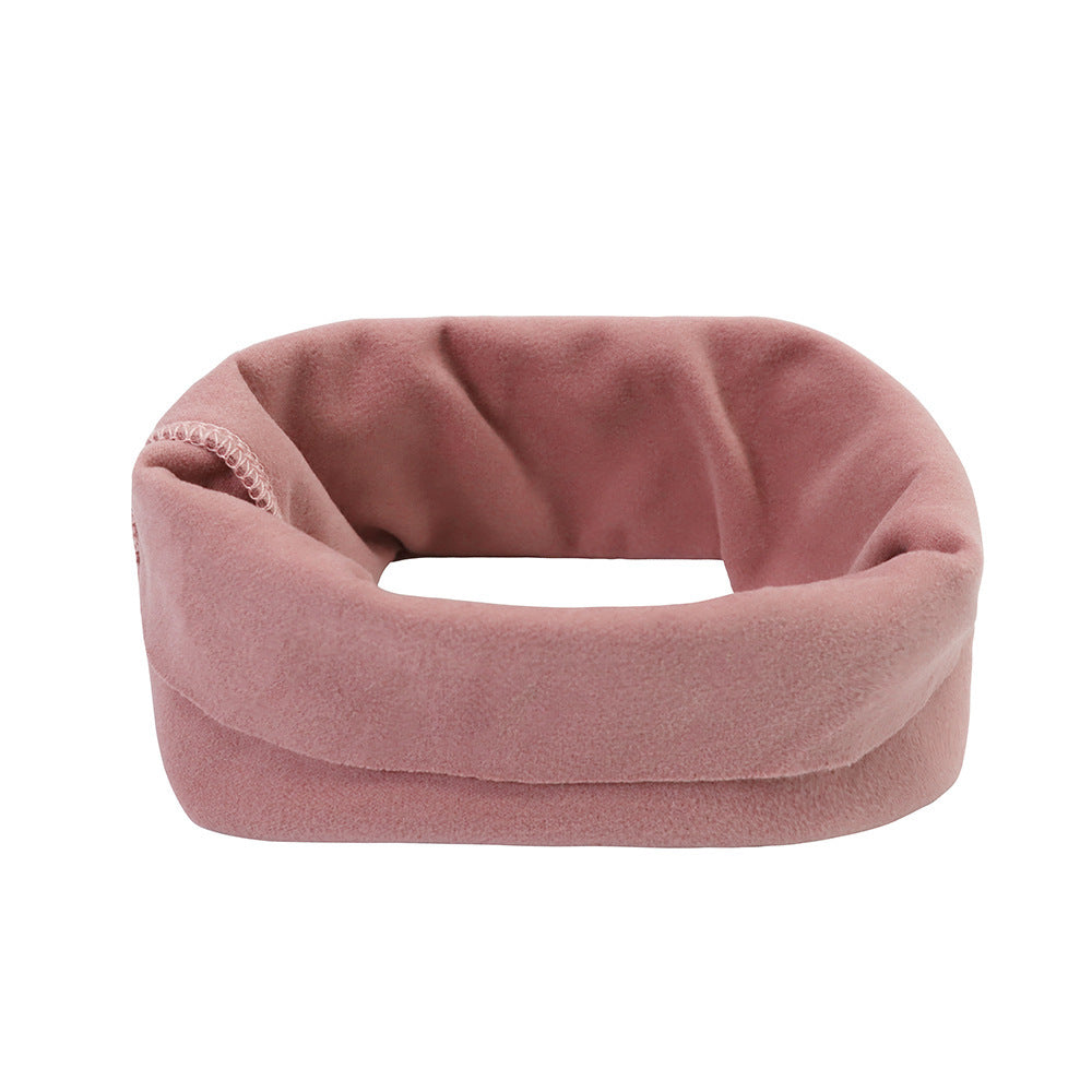 a pink fabric object with a white background