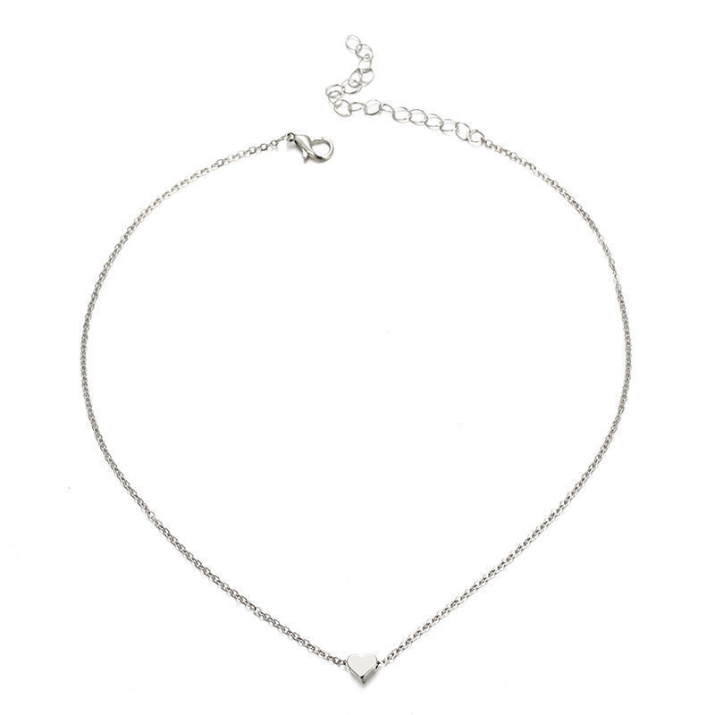 a silver necklace with a heart pendant