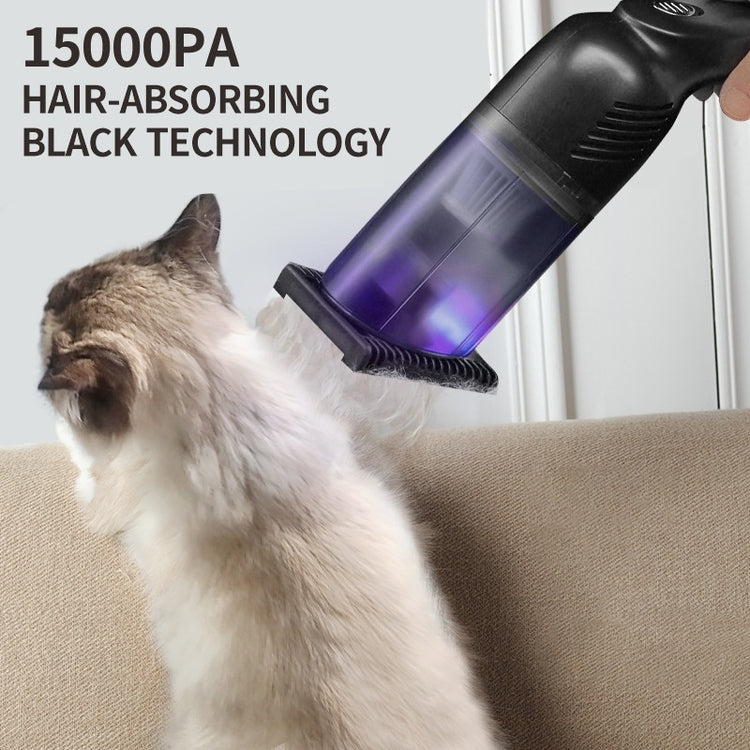 a hand holding a vacuum cleaner to a cat