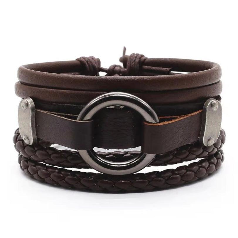 a brown leather bracelet with a metal ring