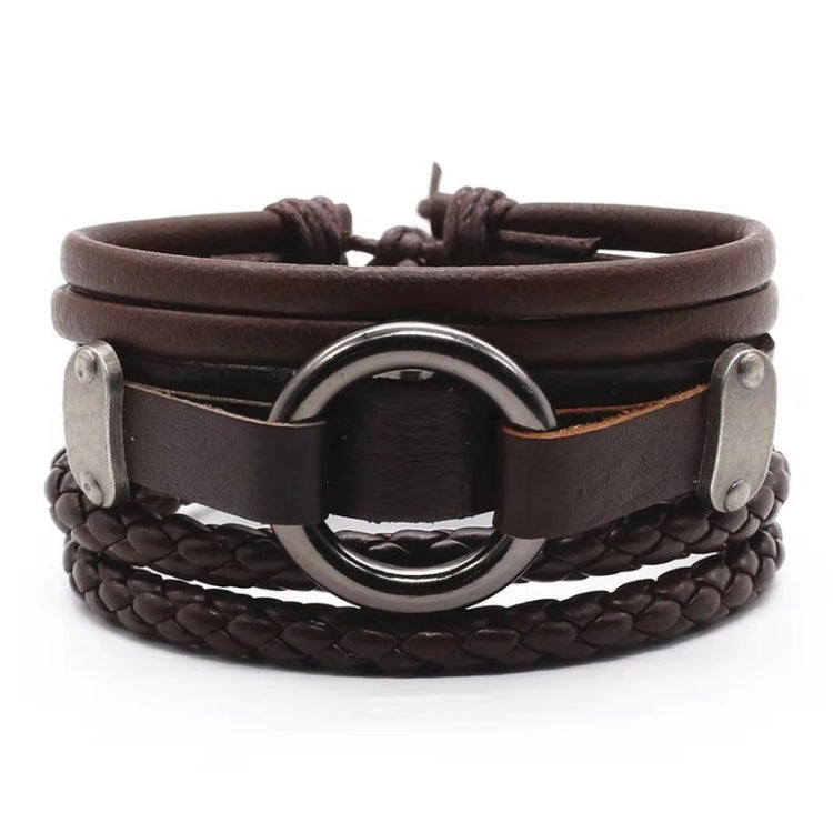 a brown leather bracelet with a metal ring
