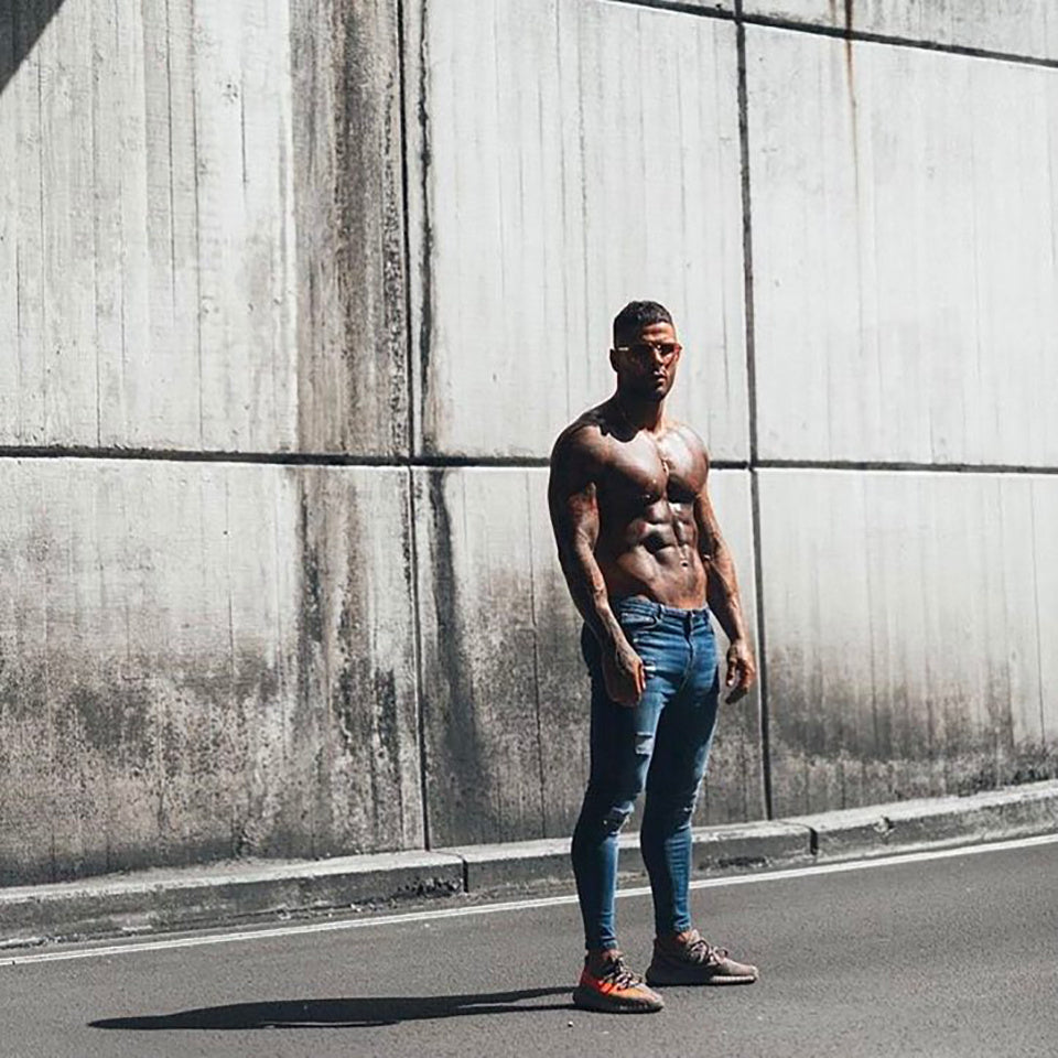 a man standing in front of a wall